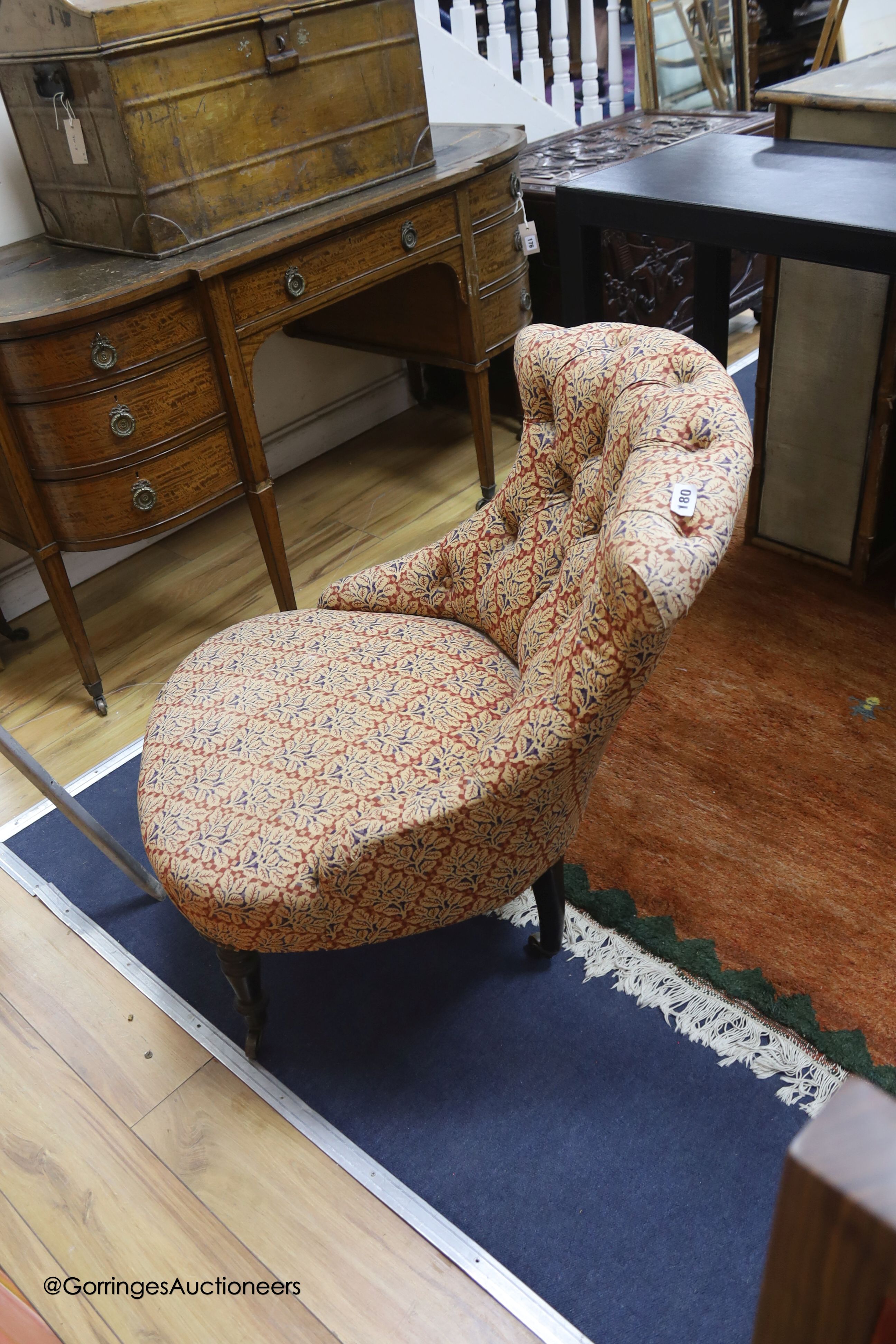 A Victoiran mahogany framed nursing chair, on front turned legs